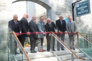 ribbon cutting ceremony at the newly expanded L&A County Museum and Archives in Napanee l-r, Bill Cox, Bill Lowry, Henry Hogg, Gord Schermerhorn, Doug Bearance, Eric Smith, Roger Cole